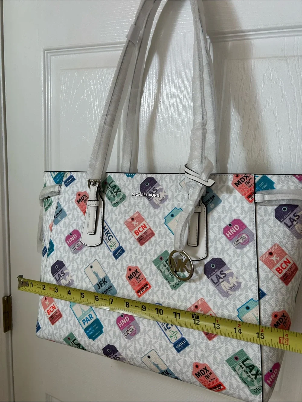 Michael Kors White Tote with Multicolor Luggage Tag Pattern